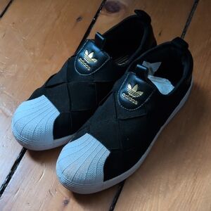 Adidas Black and White Slip-On Shoes with Gold Logo